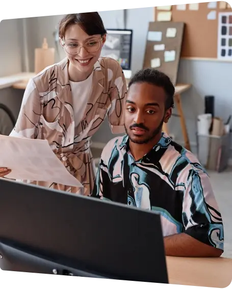 Lady and guy in front of a computer