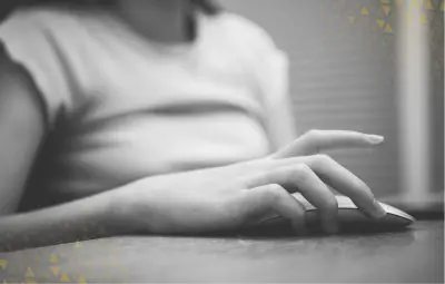 women using mouse on laptop