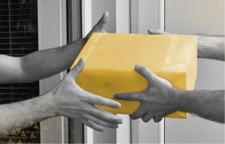 two people handing off a package