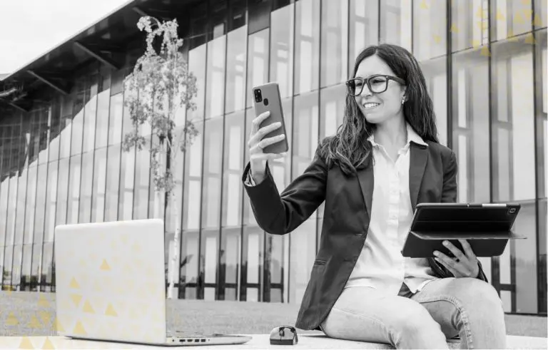 women browsing on phone, laptop, and tablet