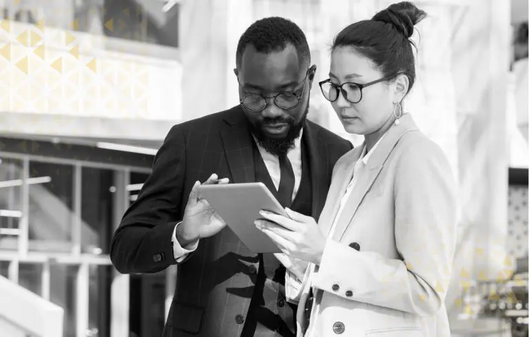 two business people discussing over a tablet