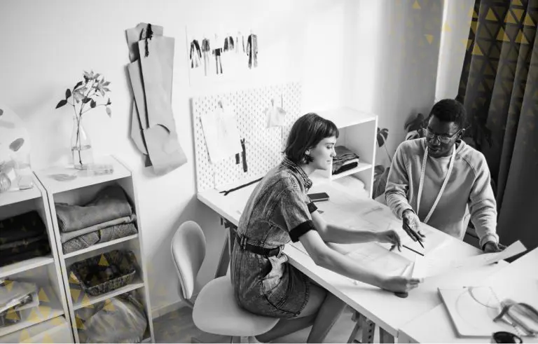 Woman and man working together at desk