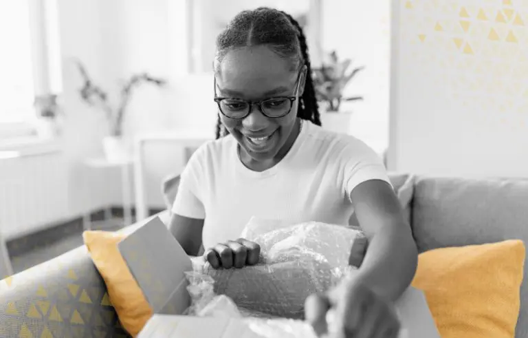 women excited while opening a package