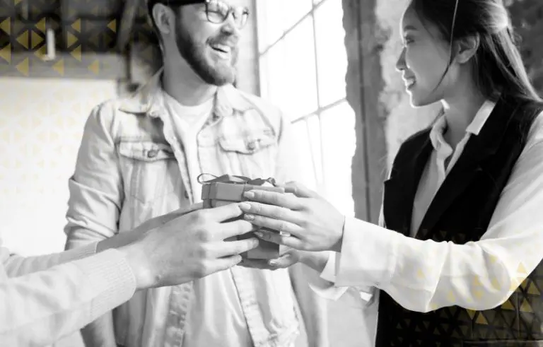 two people clinking glasses