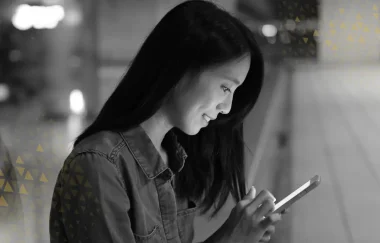 a woman on the street looking at her phone